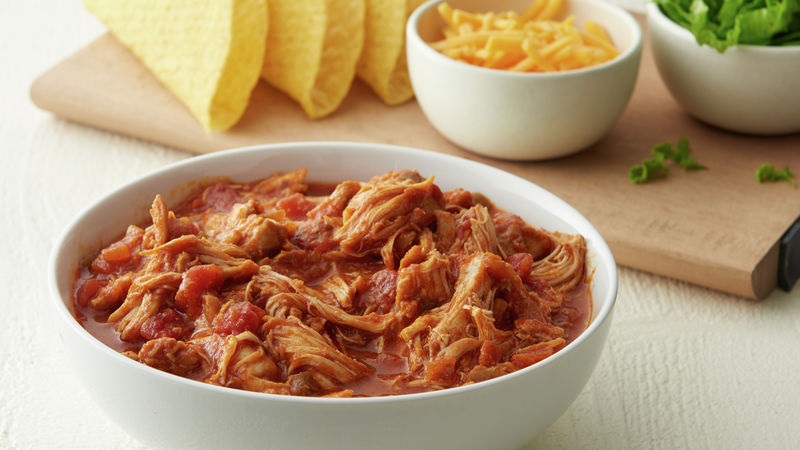 Easy slow cooker shredded Mexican chicken recipe.